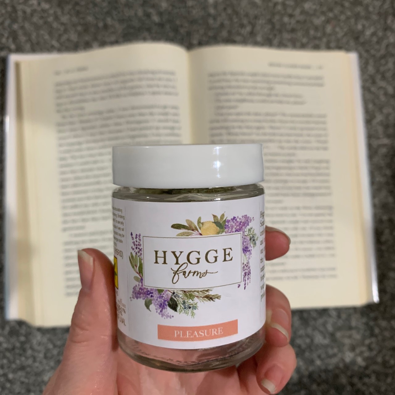 Hygge Farms and an open copy of Behind Closed Doors by B.A. Paris