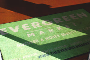 Evergreen Market mat in the enrty of our stores